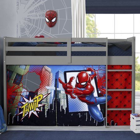 a child's bedroom with a spiderman theme on the wall and bunk bed