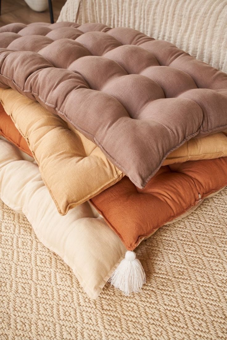 four pillows stacked on top of each other