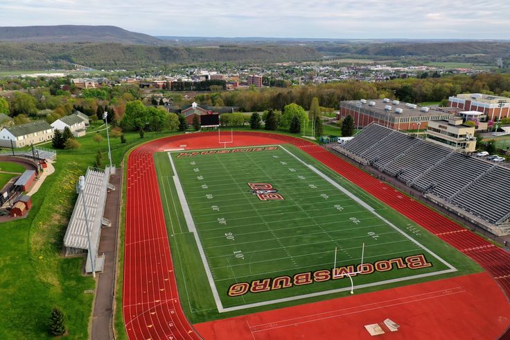 an aerial view of a football field and stadium