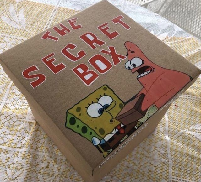 the secret box has spongebob on it and is sitting on top of a table