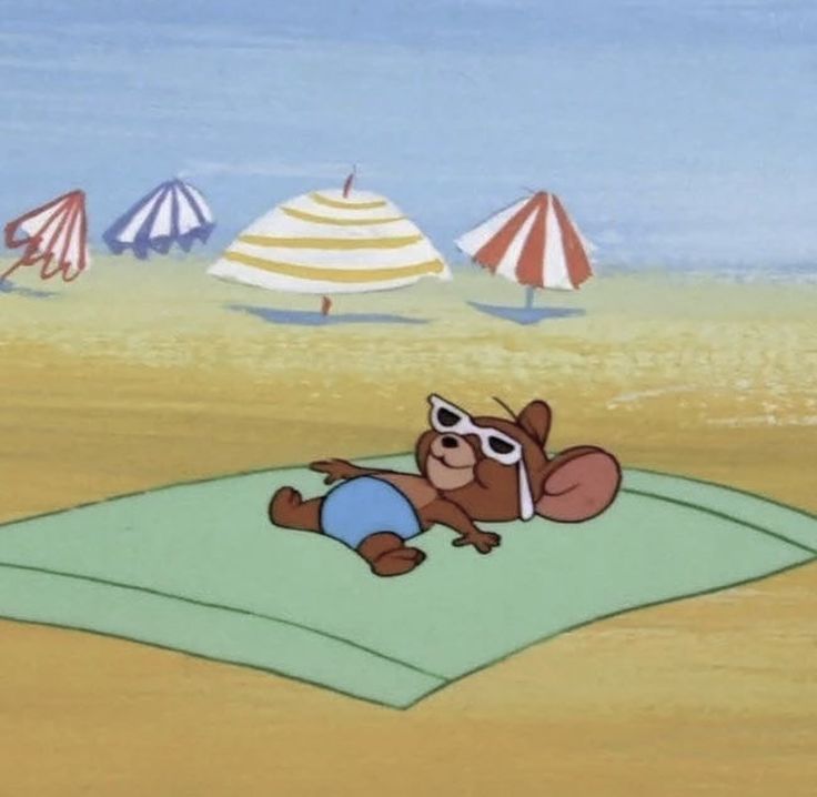 a cartoon bear laying on top of a blanket in the sand near beach umbrellas