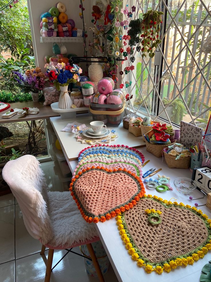 the table is covered with crocheted hearts