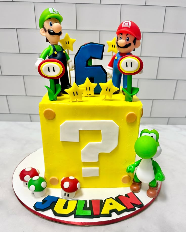 a birthday cake with mario and luigi on it