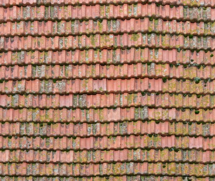 the roof of a building with red and green shingles