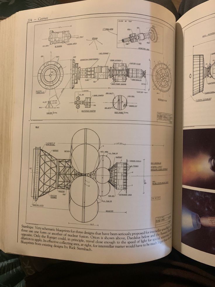 an open book with drawings and diagrams on it