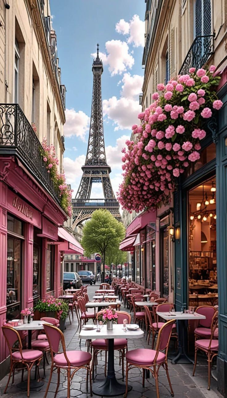 the eiffel tower is in the background of pink tables and chairs on the sidewalk