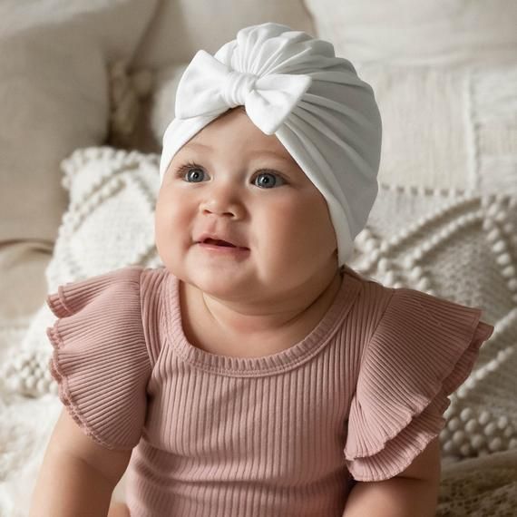 These baby turban hats are a perfect hospital hat for newborns as part of a coming home outfit. They are also a great unique baby gift for baby showers. Made from super soft cotton knit fabric. They have a comfortable stretch of about 1.5 inches. NEW neutral colored turban hats here >> https://etsy.me/3gyIcuEYou might also like our best selling headband here! >> https://etsy.me/3vdayyW>>SIZINGNewborn: 14"0-3 months: 15"3-12 months: 16.5"12-18 months: 17.5"18 months- 4T: 18.5"5T Baby Bow Hats, Baby Turban Hat, Infant Hat, Baby Winter Hats, Baby Turban, Toddler Headbands, Unique Baby Gifts, Baby Bow, Newborn Hat