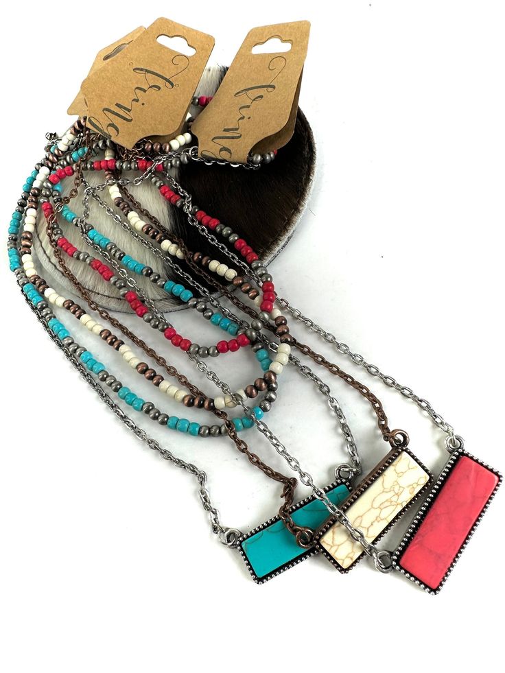 Western layered dainty necklace: Turquoise/silver,, ivory/copper, or red/silver Beads- 4mm faux Navajo pearls and 4mm howlite gemstones Necklace Length: Approx. 19" and 16" +3" Faux red bar stone- Approx. 1.3" W Burnished distressed metal   Stones will vary in design.  Each is has different characteristics. Nickel and lead compliant FINAL SALE- please check dimensions and details before purchasing, just to ensure these will work for you! Shop polices & the fine print: :) I want you to LOVE your Western Bar, Ivory Necklace, Dainty Necklace Layered, Red Pendant, Red Bar, Navajo Pearls, Red Pendants, Pendant Choker, Necklace Turquoise