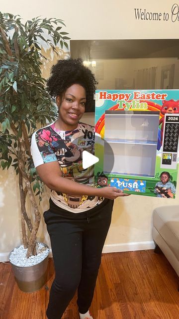 a woman holding up a happy easter box