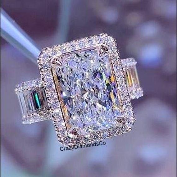 a fancy ring with an assorted diamond and baguette cut diamonds on it