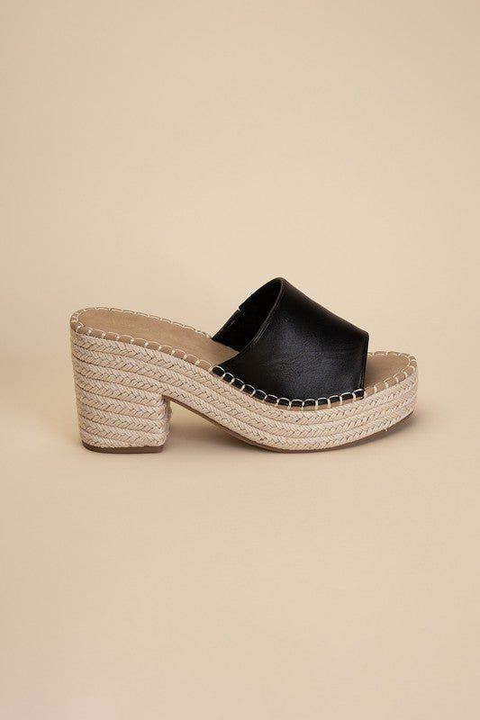 Step into style and comfort with our black Platform Espadrille Heel Mules! Perfect for any vacation or beach getaway, these mules will elevate your look with their trendy block heel. Slip them on and step out in style! Fit true to size Vacation High Heel Block Heels With Padded Heel, Chic Summer Wedge Heel Block Heels, Vacation High Block Heels With Padded Heel, Black Slip-on Heels For Summer, Chic Summer Wedge Block Heels, Chic Summer Wedge Heels, Closed Toe Beach Sandals With Padded Heel, Closed Toe Sandals With Padded Heel For Beach, High Heel Mules With Padded Heel For Beach