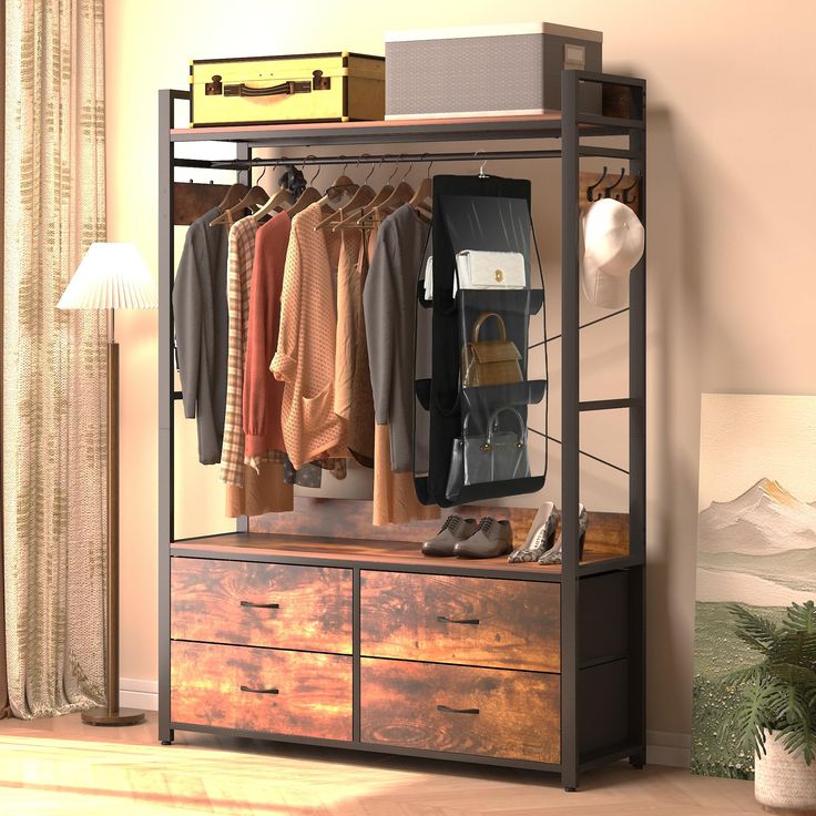 an image of a closet with clothes hanging on the rack and other items in it