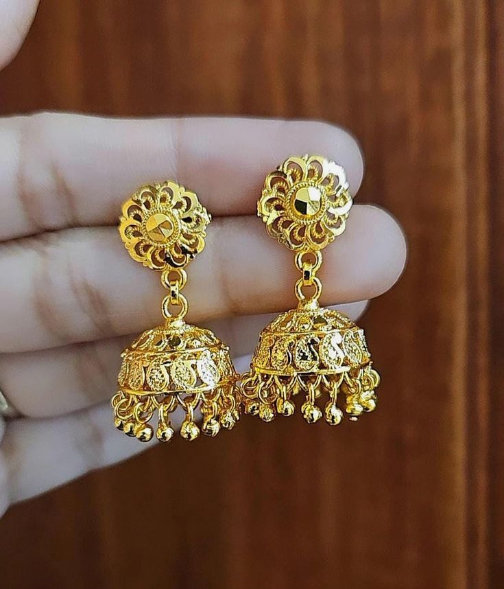 22k Real Dubai Gold Finish Small Dangling Jhumka Earrings.  *Simple - Lightweight- cute 😍, *Size:  Drop Length 3.5 Cm and umbrella jhumkas width each 2 Cm. * Best For everyday wear but maintain our jewelry Care guidelines. ●SAME Day Shipping if you place order between  1 am to 1 pm.  ● Ships Next working day from New York city with USPS standard 3-5 working day delivery service.  ● Free Shipping Over $35 Shopping. ● Everyday Wear Convince Earrings for Gold Lovers. ● Handmade and Finished Simple Festive 22k Gold Jhumkas With Latkans, 22k Gold Chandbali Danglers With Latkans, Gold Jhumkas For Festive Occasion, Bollywood Style Yellow Gold Jhumkas With Latkans, Chandbali Jhumkas With Latkans For Puja, 22k Gold Earrings For Puja Navratri, 22k Gold Earrings For Puja During Navratri, 22k Gold Cutdana Earrings For Puja, 22k Gold Jhumkas With Intricate Design For Puja