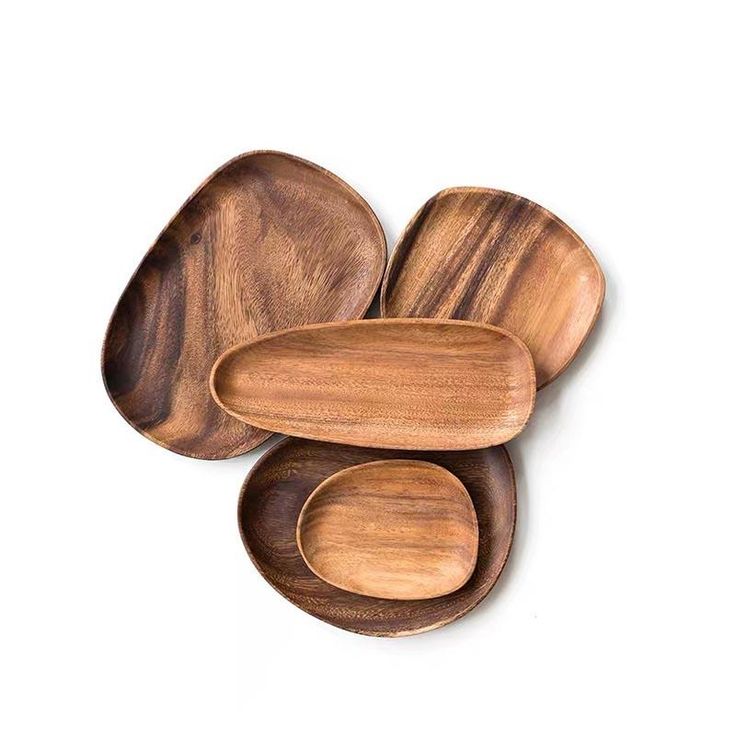 three wooden spoons are stacked on top of each other