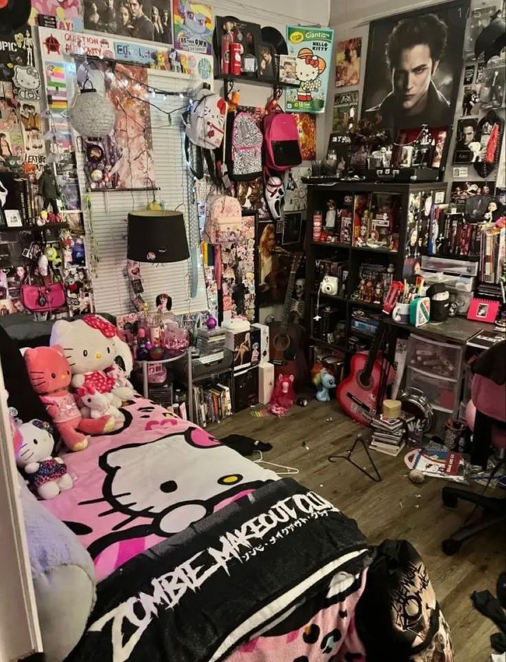 a bedroom with hello kitty bedding and lots of posters on the wall above it