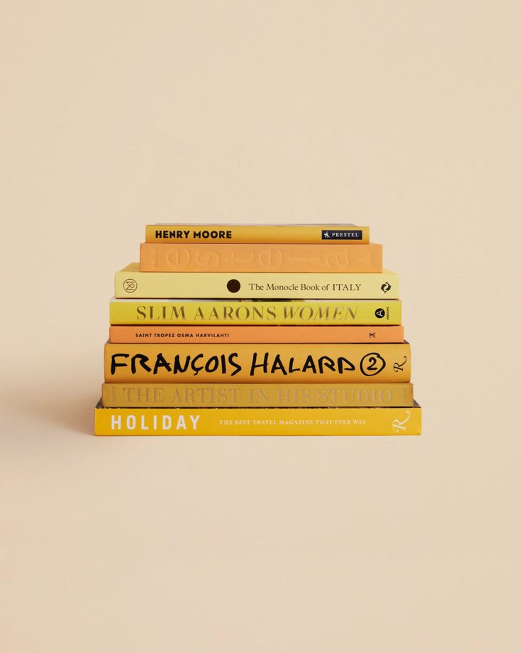 five books stacked on top of each other in front of a beige background with the title, holiday