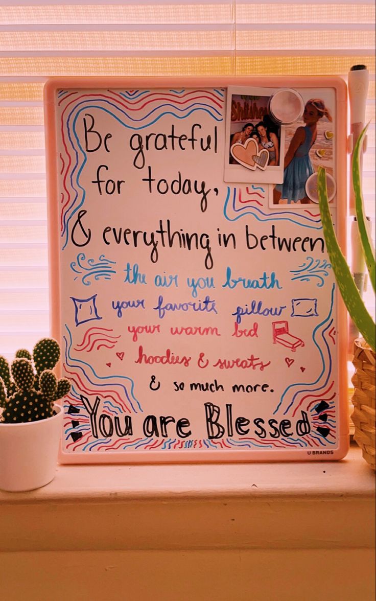 a sign on a window sill that says be grateful for today and everything in between