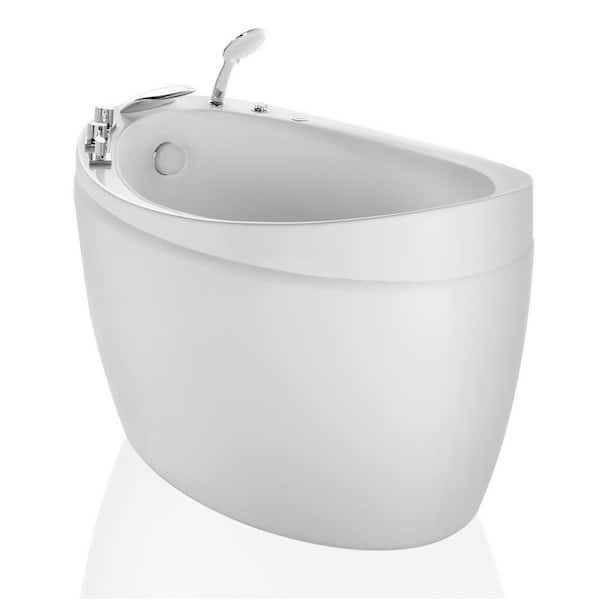 a white bath tub sitting on top of a white floor