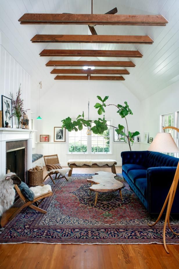 a living room filled with furniture and a fire place