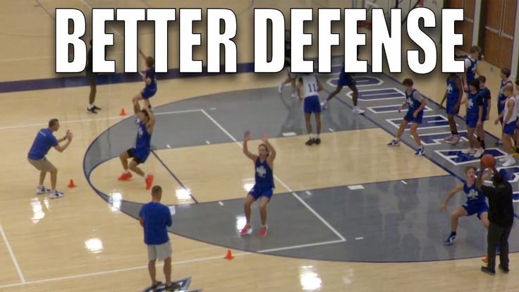 a group of people standing on top of a basketball court with the words better defense in front of them