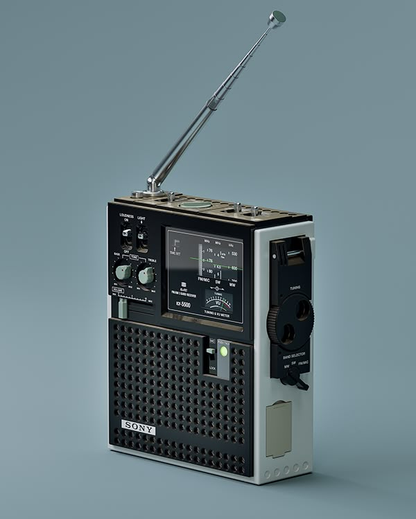 an old fashioned radio on a gray background with a metal antenna attached to the receiver