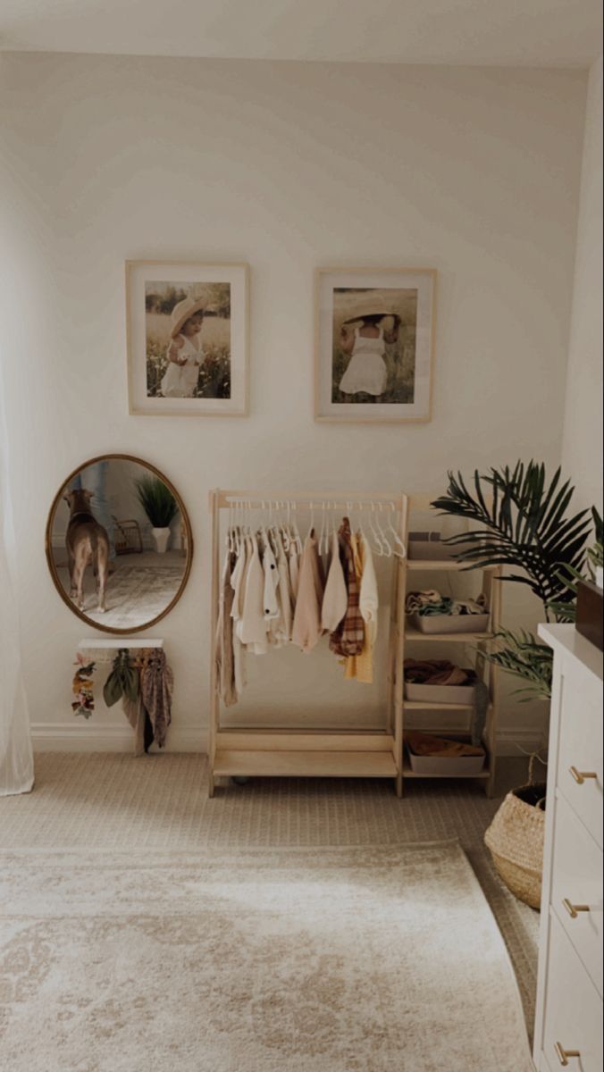 a room with white walls and pictures on the wall