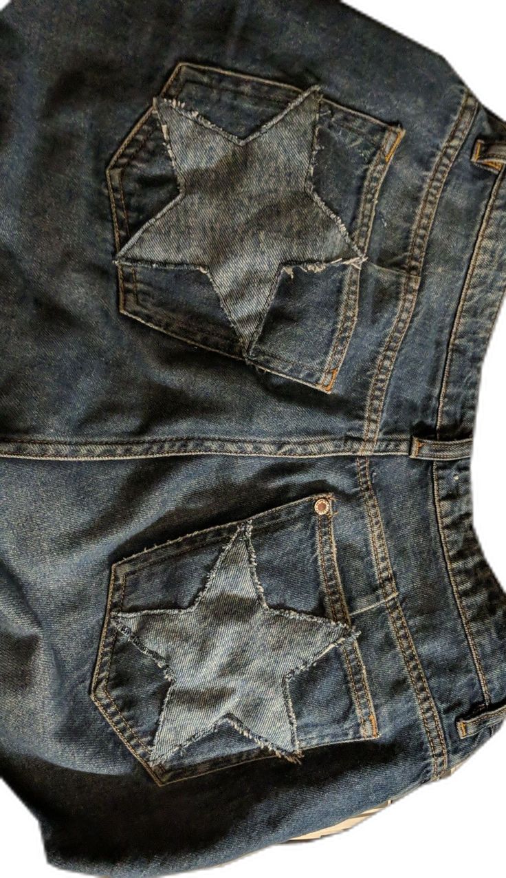 a pair of blue jeans with stars on them