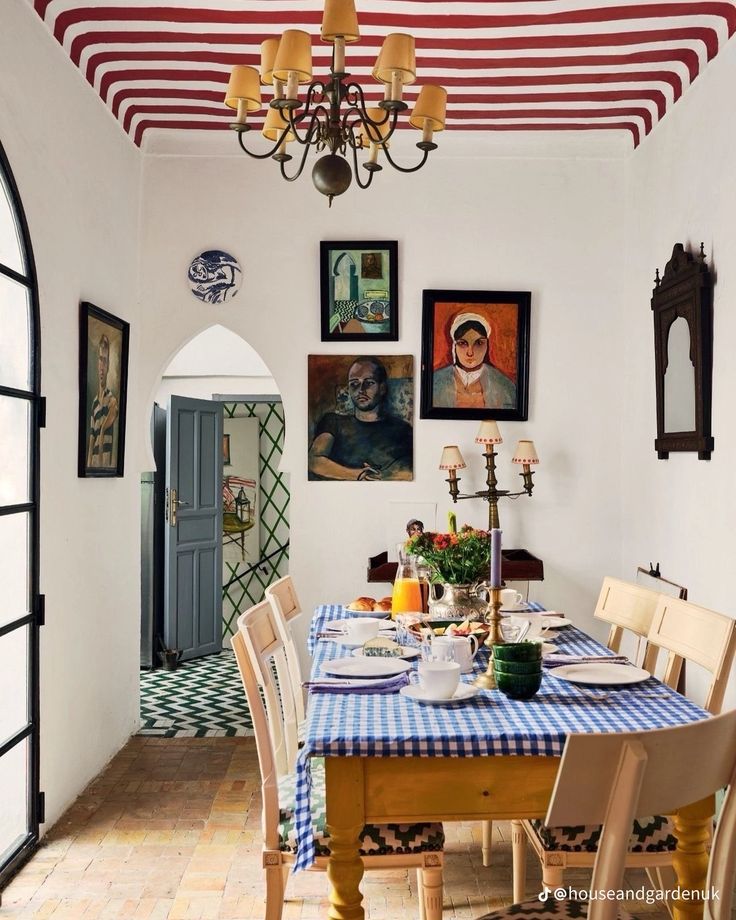 a dining room table is set with plates and glasses