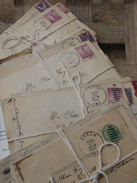 several old envelopes tied together with string