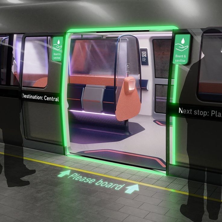 people are standing in front of the door of a subway car that has green lights on it