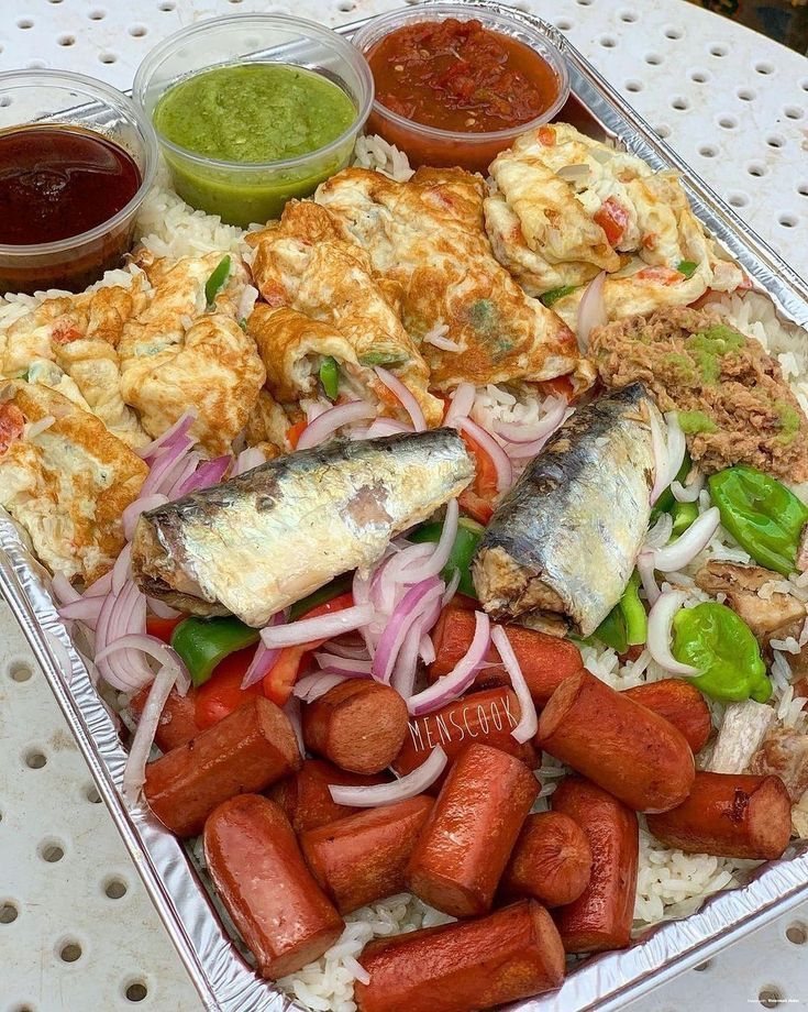 a tray filled with different types of food and condiments on top of it