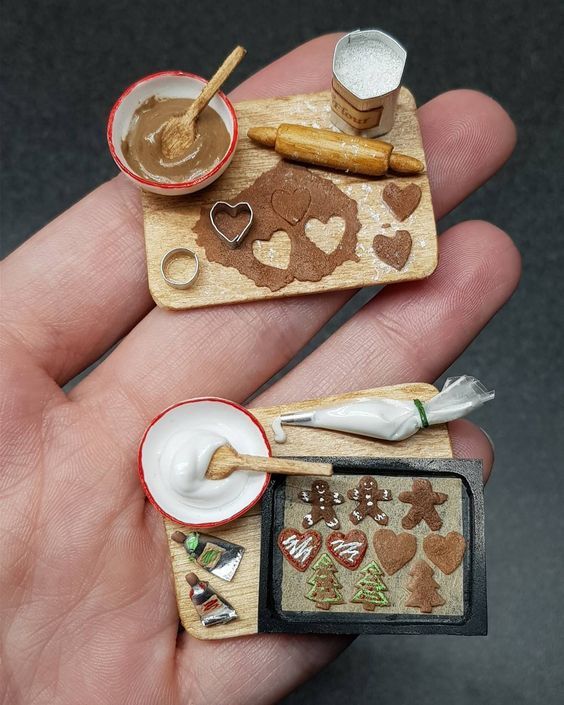 two miniature handmade items are shown in the palm