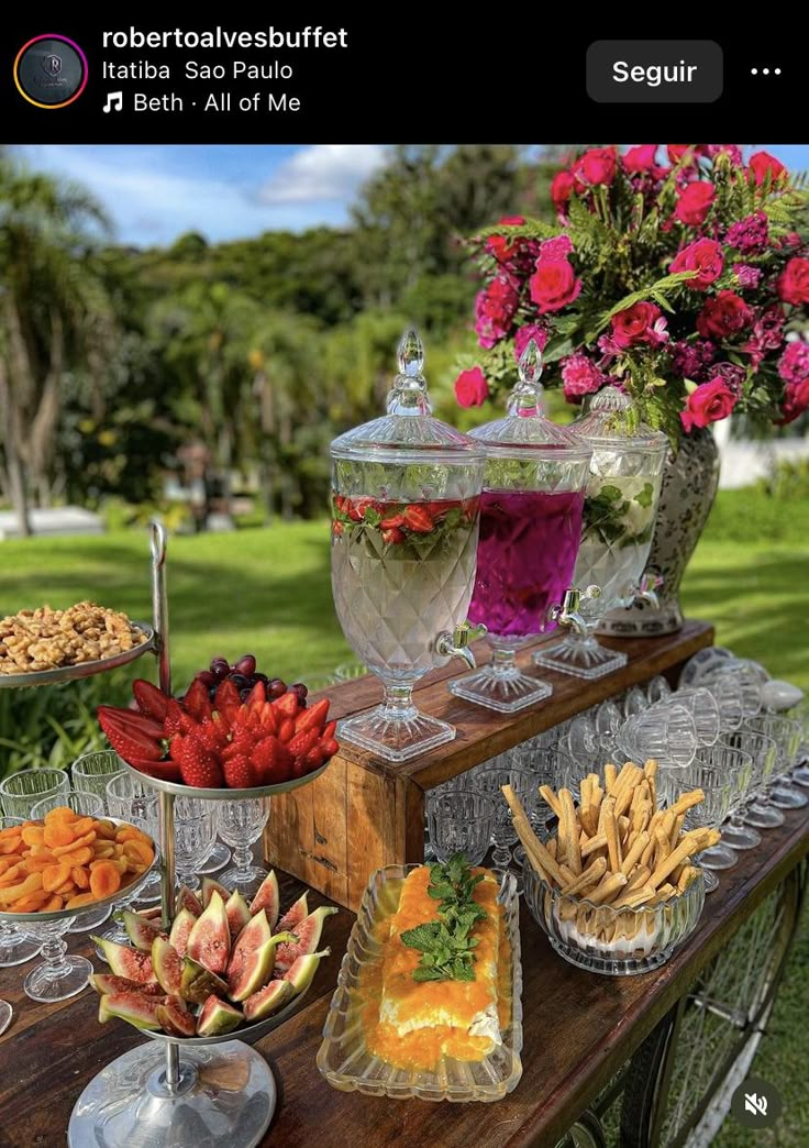 a table topped with lots of different types of foods and desserts on top of it