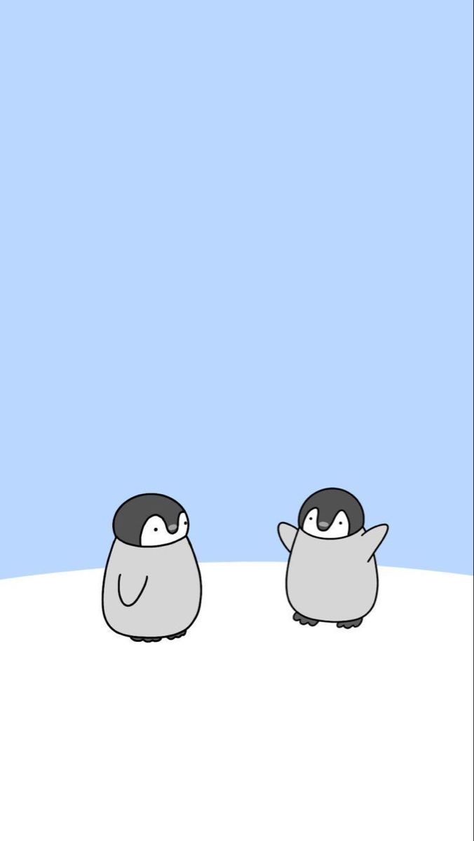 two penguins standing next to each other on a snow covered ground with blue sky in the background