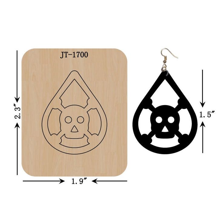 a pair of wooden earrings with an image of a skull in the center