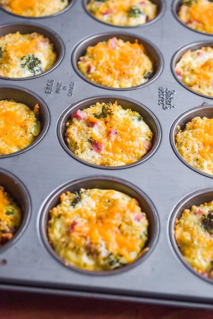 a muffin tin filled with different types of food