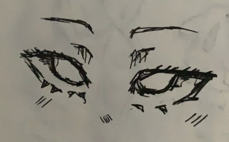 a drawing of a woman's face with eyes drawn on paper