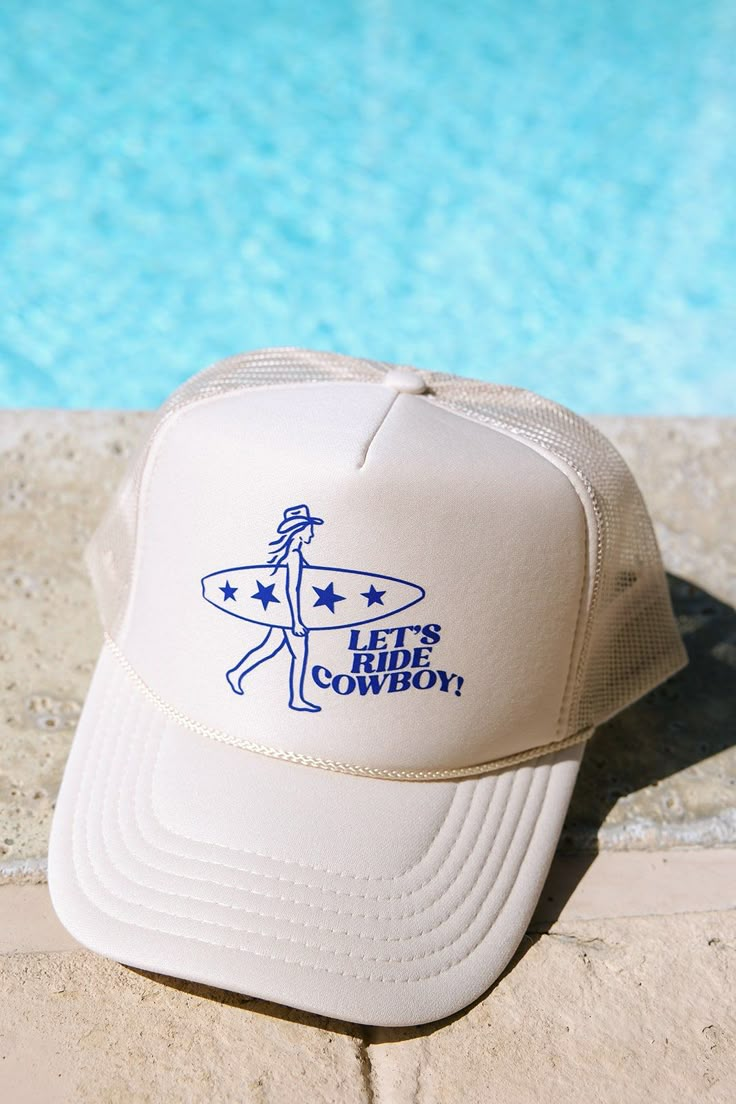 Get beach-ready with our 'Let's Ride, Cowboy' hat! Printed on a tan foam trucker in royal text. Perfect for sunny days by the shore, it's your go-to for chill vibes and fun times under the sun. I do not accept returns or exchanges! I am not responsible for missing/stolen packages please contact your local post office. If your item comes damaged please message me!  If you need to rush your order please message me to make sure I am able to fulfill the order in the desired timeframe. You are responsible to update your shipping method in the checkout.  For wholesale inquires please message me! Retro Summer Trucker Hat With Wide Brim, Retro Wide Brim Trucker Hat For Summer, Tan Trucker Hat, Wide Brim Trucker Hat For Summer Rodeo, Beige Trucker Hat With Flat Brim, Beige Flat Brim Trucker Hat, Summer Rodeo Trucker Hat With Flat Brim, Summer Rodeo Truck Hat With Flat Brim, Retro White Trucker Hat For Beach