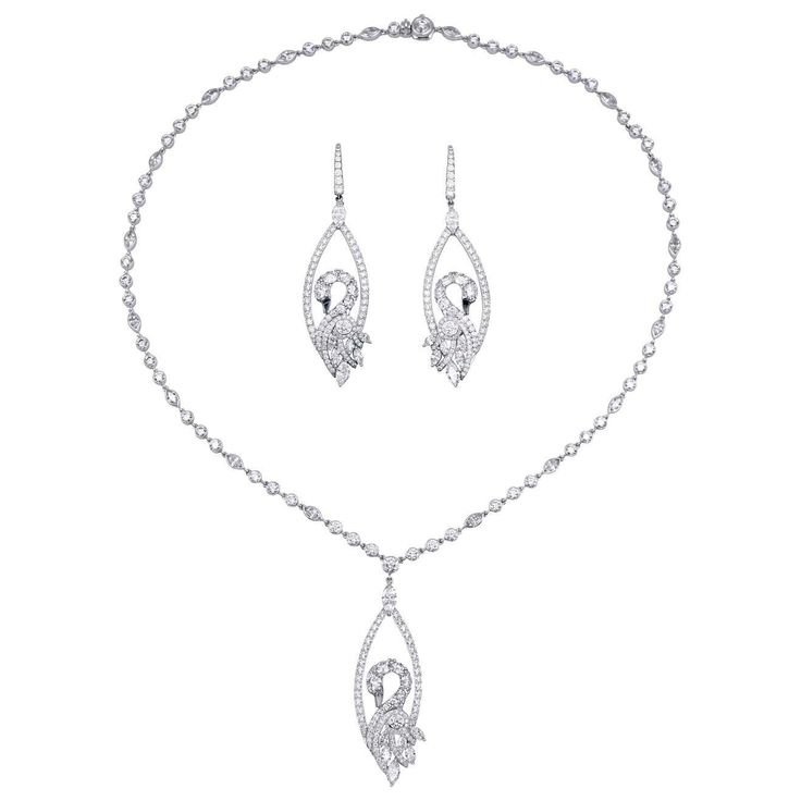 Graff 18K White Gold & Diamond Swan Earrings & Necklace  A very romantic earrings and necklaceset, designed as a swan. The earrings are set with 14 marquise and 190 round diamonds estimated to weigh a total of approximately 7.16 carats while the necklace has 25 marquise and 141 round diamonds estimated to weigh a total of approximately 11.27 carats.  Both the earrings and the necklace are signed Graff, numbered and stamped AU750. Dimensions: Earrings are approximately 2 3/4( L) inches.                        Pendant is approximately 1 7/8(L) inches.                       Diamond Chain is approximately 18( L) inches.  Weight:  Necklace is approximately 30.3 grams.                Earrings are approximately 18.8 grams  Accompanied by a Original Graff paperwork and Graff box.  If you have any Yellow Diamond Jewelry, Swan Earrings, Gold Swan, Graff Diamonds, Earring And Necklace Set, Romantic Earrings, Diamond Chain, Yellow Diamond, Brilliant Diamond