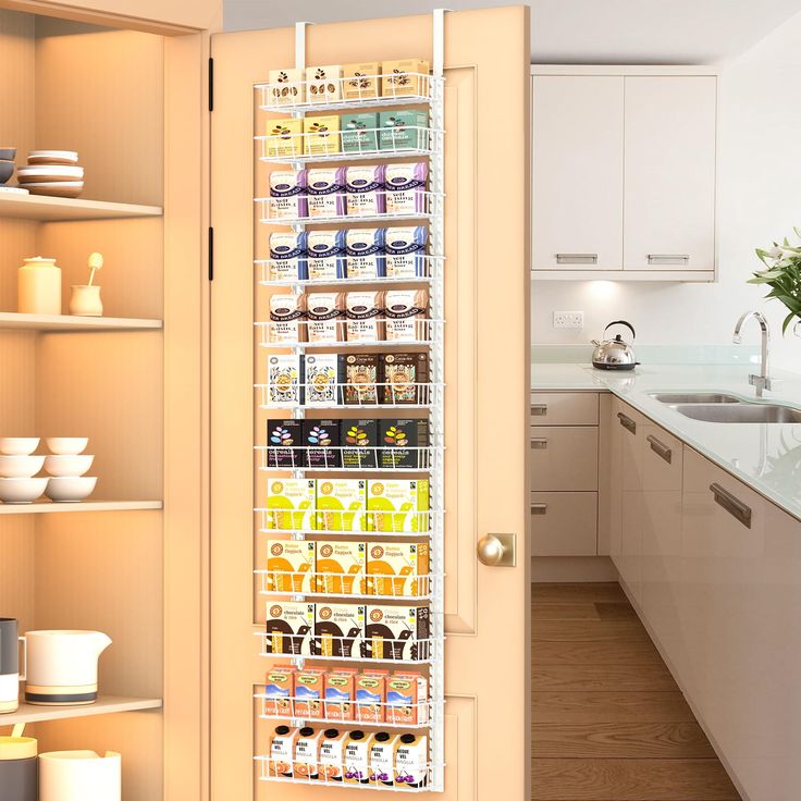 the pantry door is open to reveal an assortment of food items in its bins