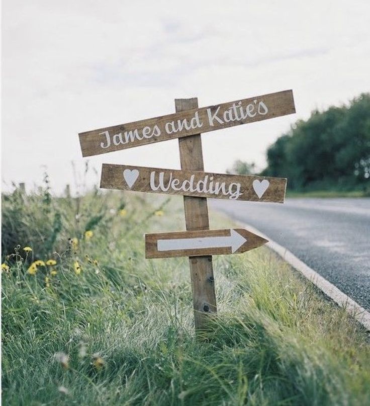 a wooden sign that says james and kate's wedding