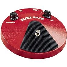 a red pedal with black knobs on it's face and the words buzz face