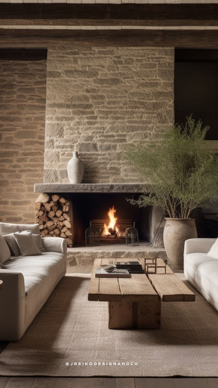 a living room filled with furniture and a fire place next to a wall mounted fireplace