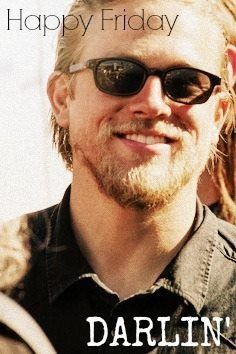 a man wearing sunglasses is smiling for the camera