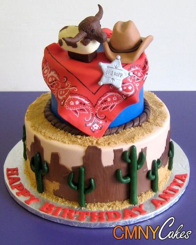 a birthday cake decorated with cowboy hats and cactus