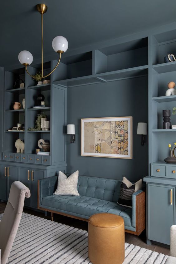 a living room with blue walls and furniture