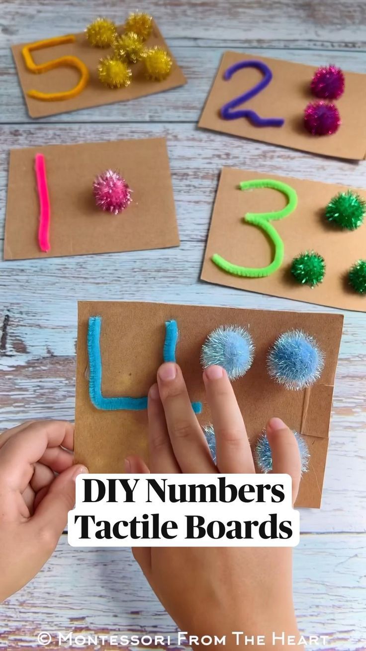 someone is doing crafts with numbers and pom poms