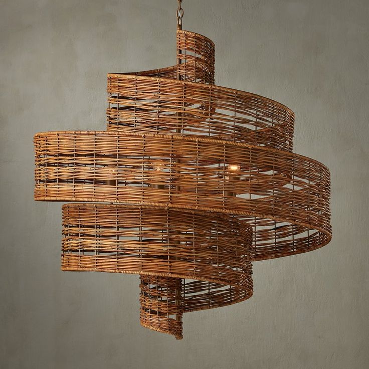 a woven light fixture hanging from a ceiling