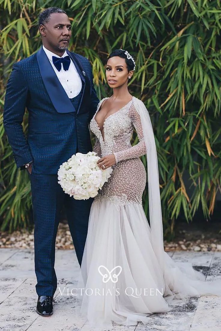 a bride and groom posing for a photo