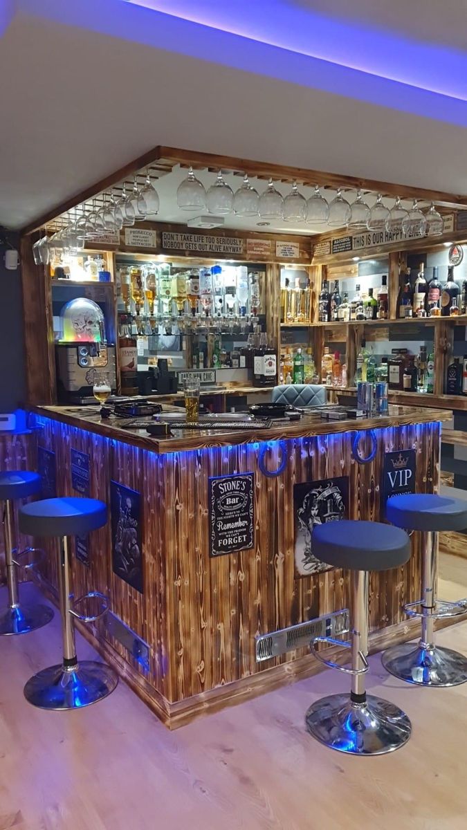 an empty bar with stools in front of it